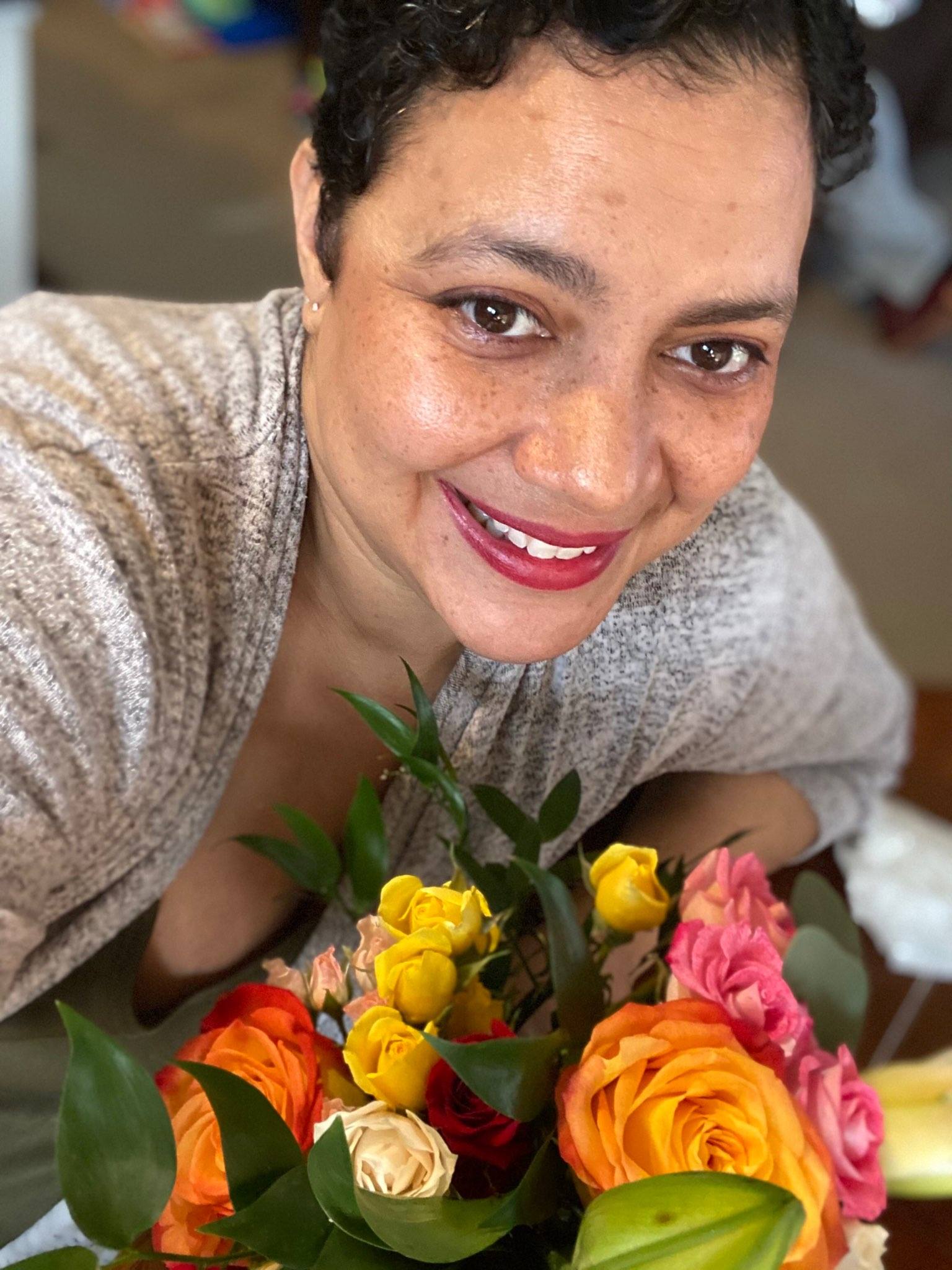 Farah holding flowers.