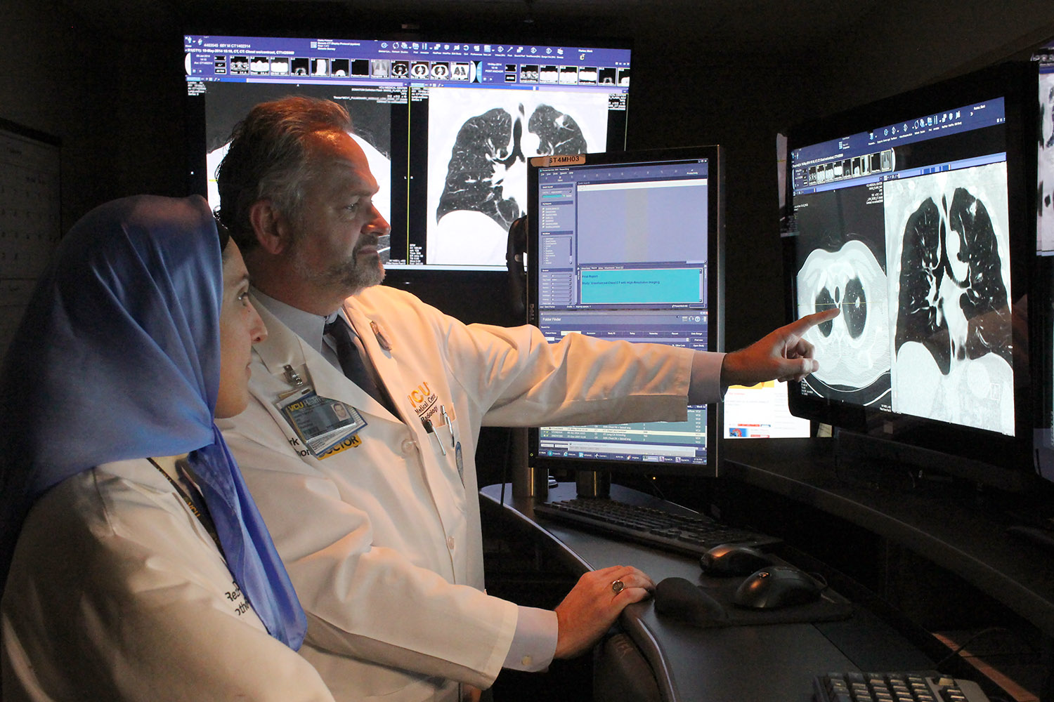 Two radiologists review a low-dose CT lung scan