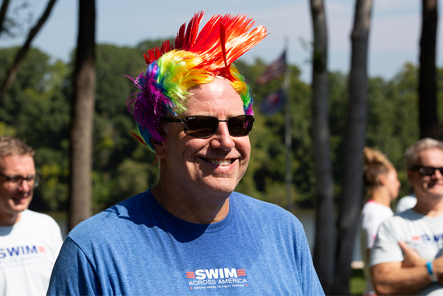 George Sushkoff donning a “crazy wig” at the 2022 Swim Across America Richmond event.