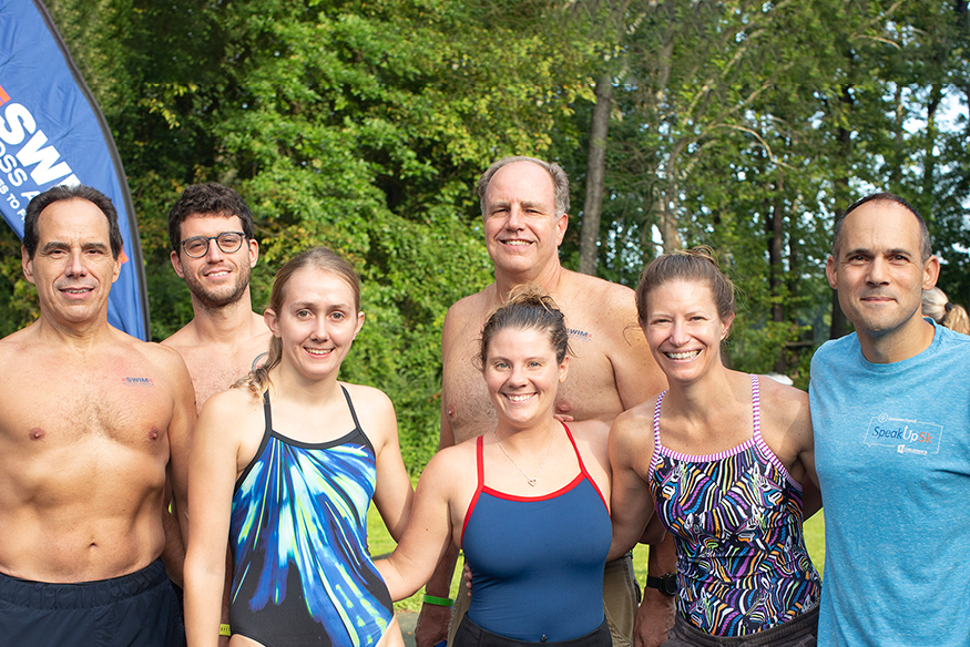 George Sushkoff (back, center) and members of his training and fundraising team, at the Swim Across America open water event in 2022.