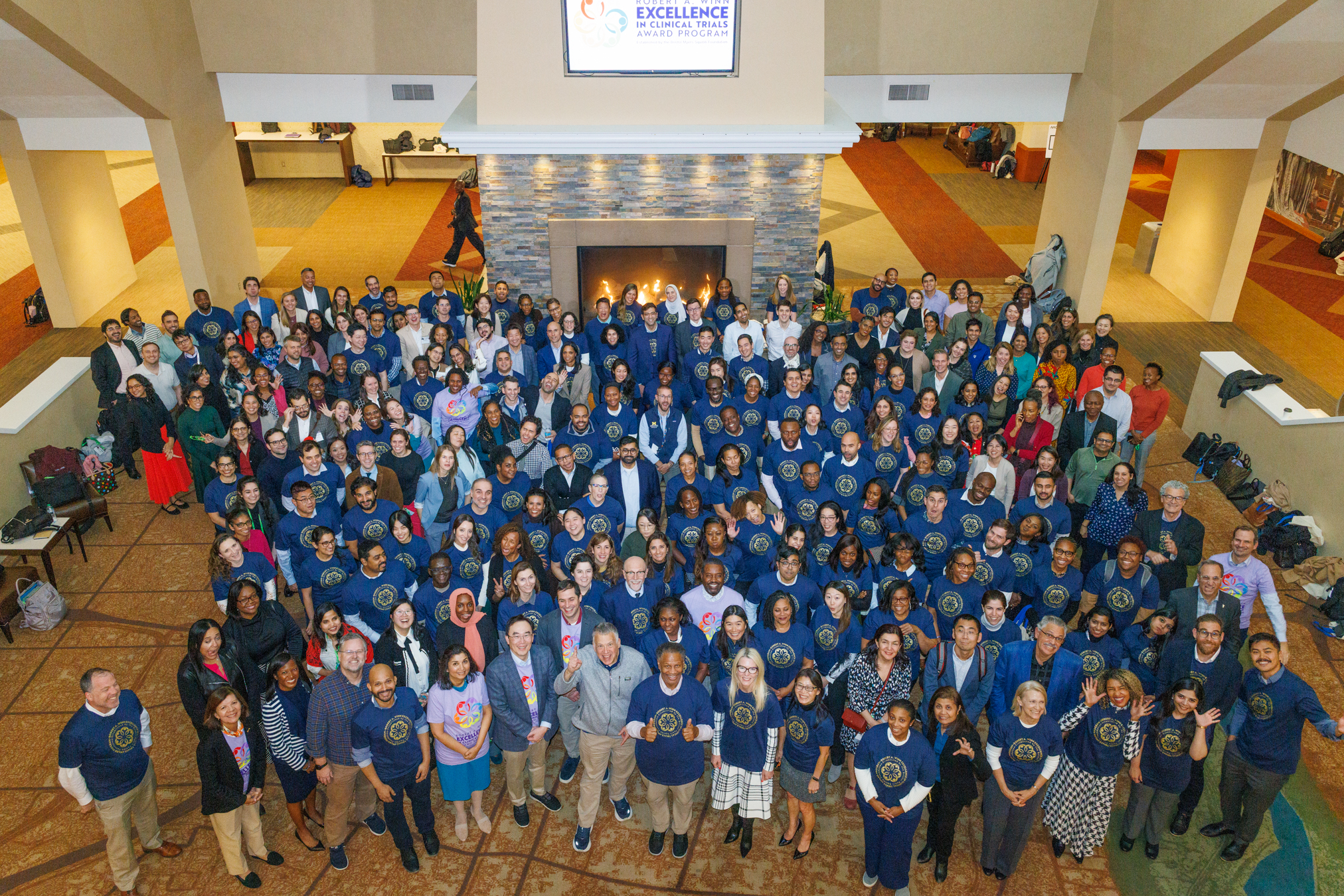 Aeriel view of group of people with blue event t-shirts