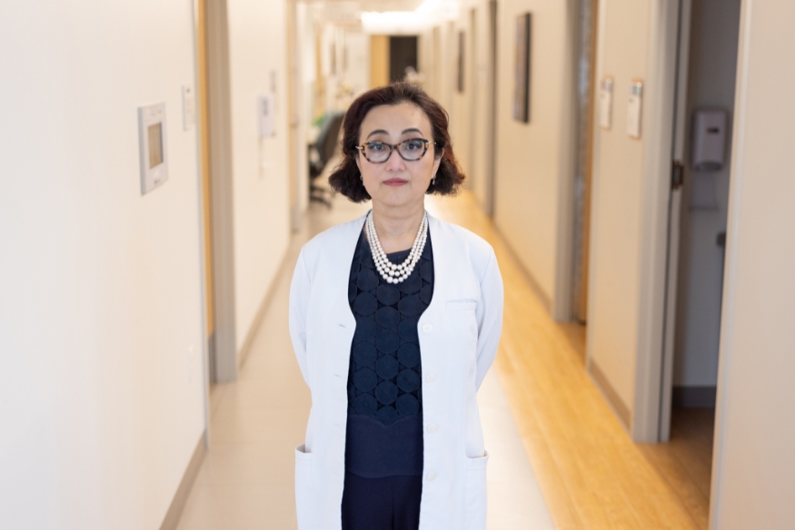 Photo of Susan Hong, M.D. standing in hospital halls