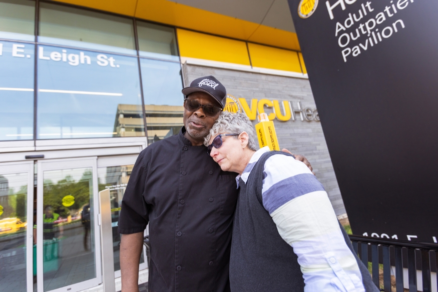 Photo of Melissa Earley hugging Lilton Sykes