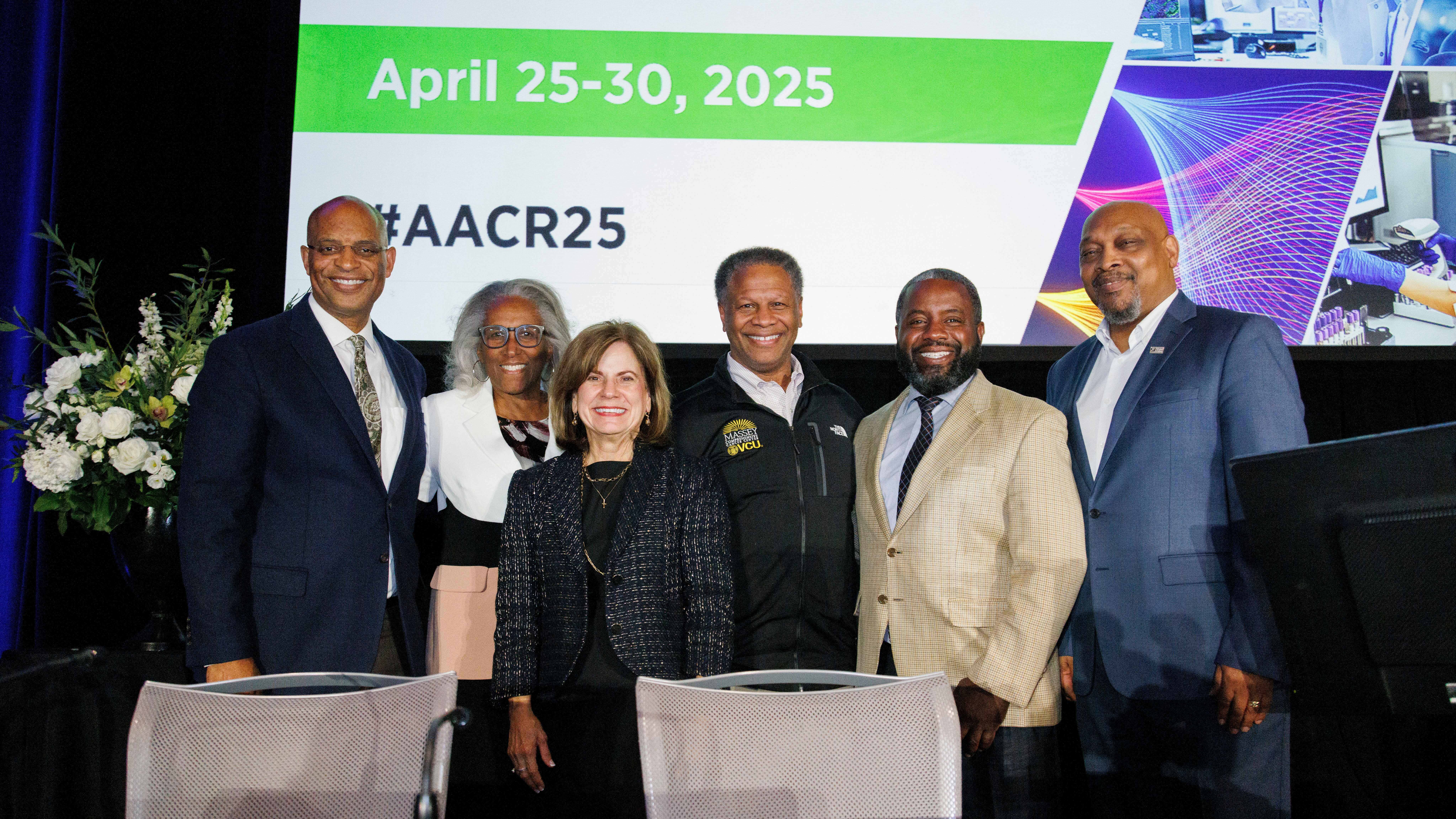 Photo of Dr. Winn and colleagues at 2025 AACR event