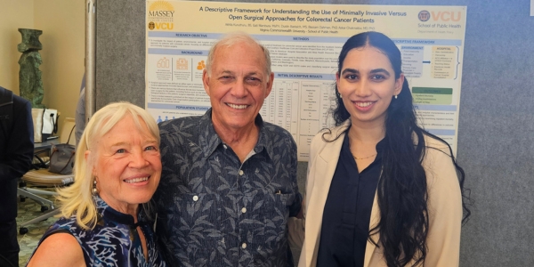 Akhila Kunuthuru and Nancy and Jack Haar pictured next to research poster