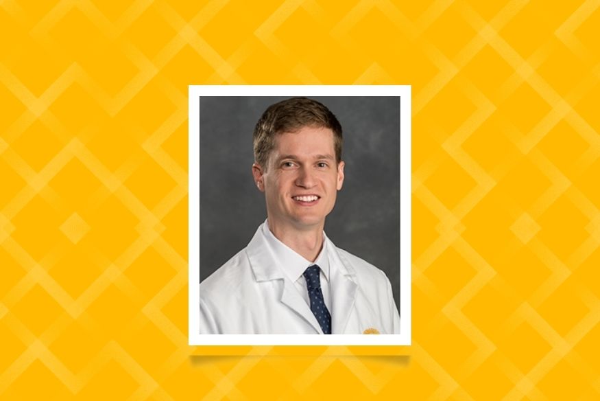 Jack Melson professional headshot with whitecoat