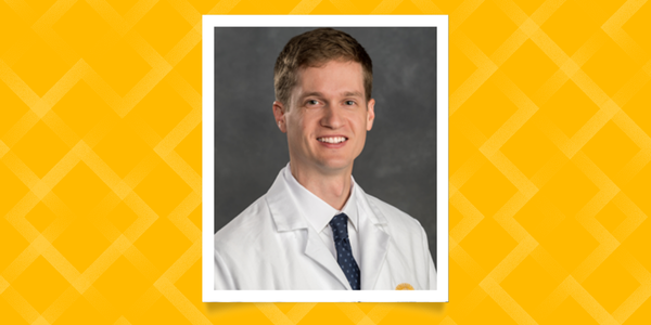 Jack Melson professional headshot with whitecoat