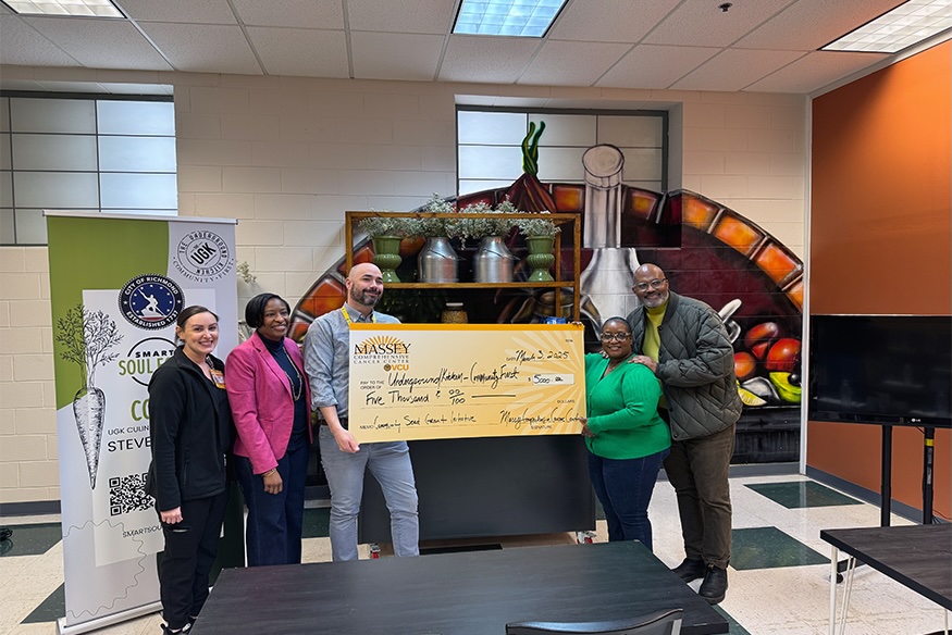 The Underground Kitchen Community First group photo with SEED grant check