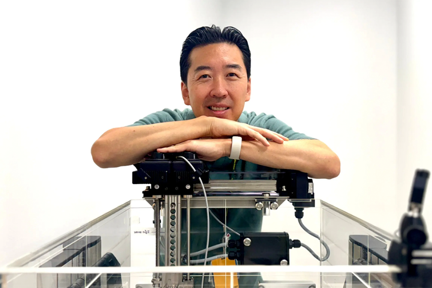 William Song pictured with portable water tank equipment