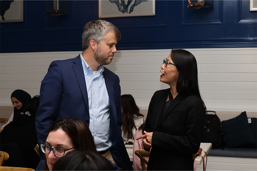 Nolan Wages, Ph.D. speaks with conference attendee