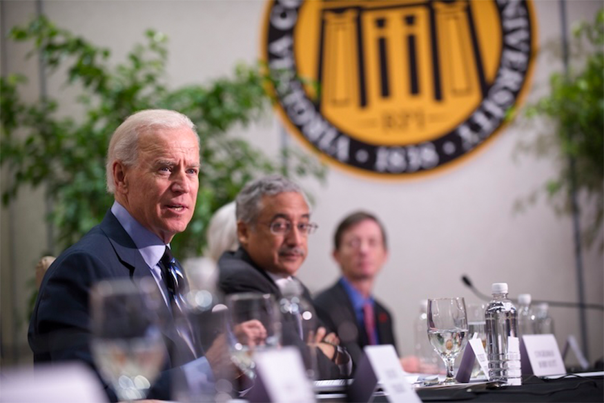 Joe Biden speaking with VCU logo in the background