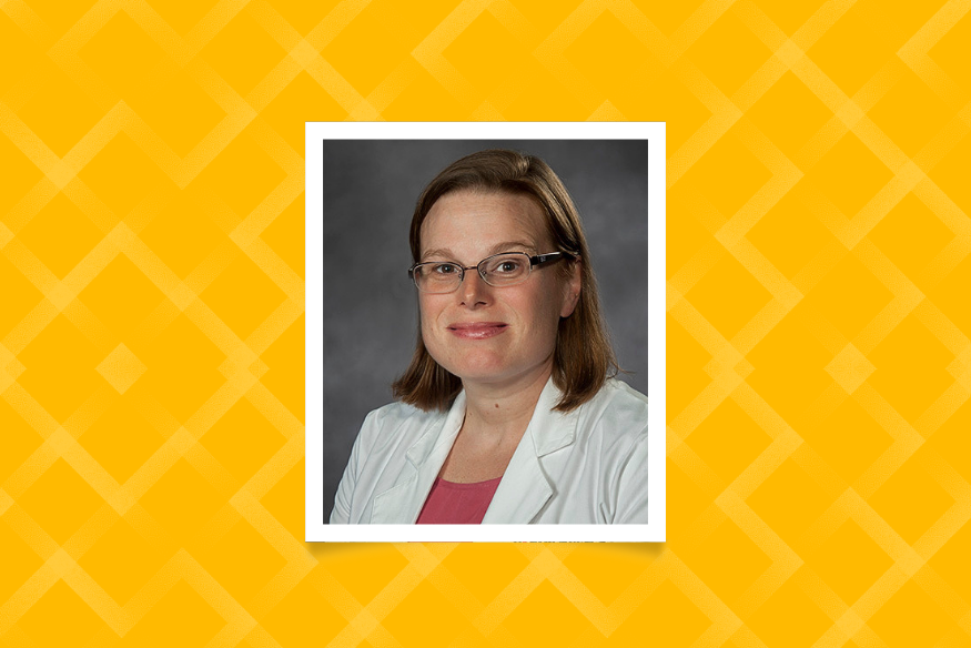 Headshot of Dr. Frances Austin wearing glasses and a white lab coat over a pink top, framed on a bright yellow patterned background.