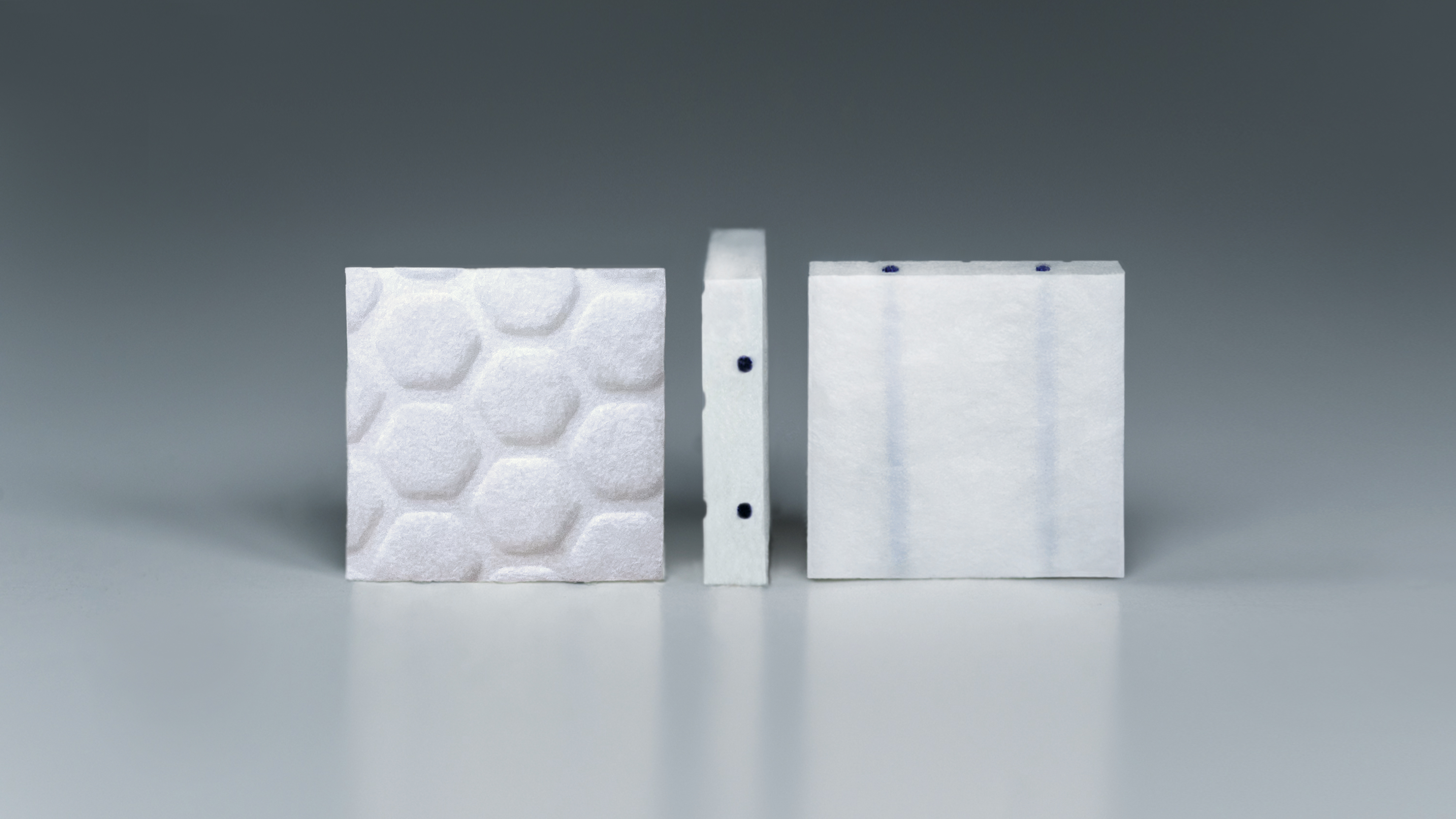 Photography of gammatile, a white square imprinted with tile markings