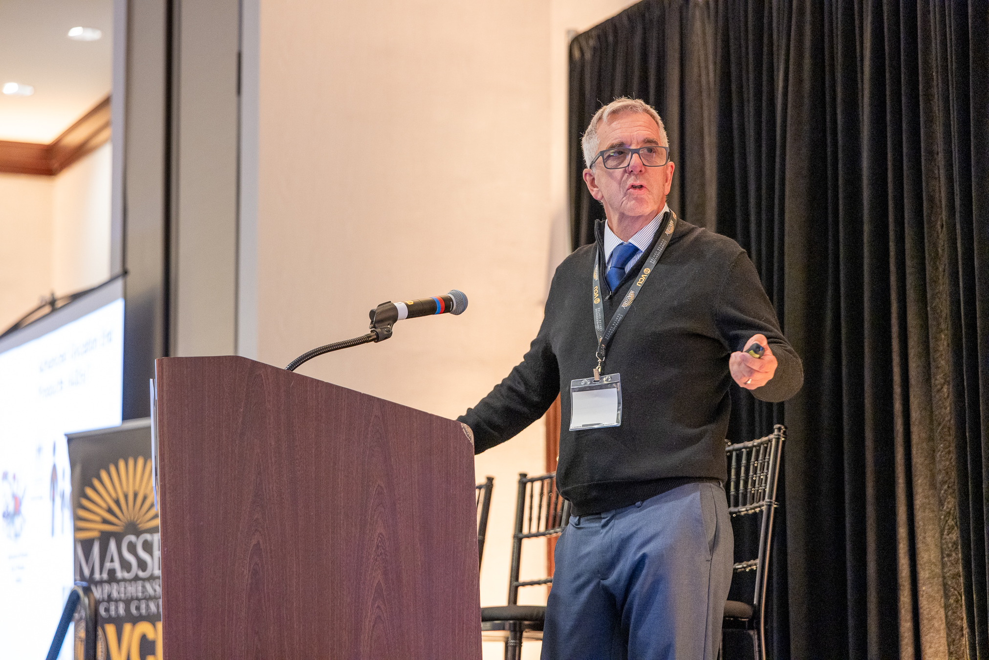 Man standing at wooden podium