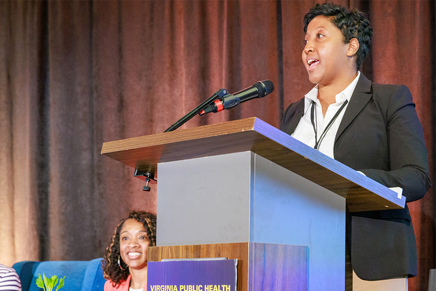 Presenter Marcie Wright, Ph.D., MPH at a podium