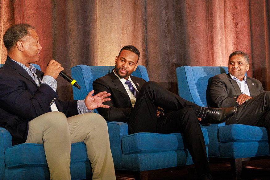 Winn, Webb and Avula conversing during a panel discussion