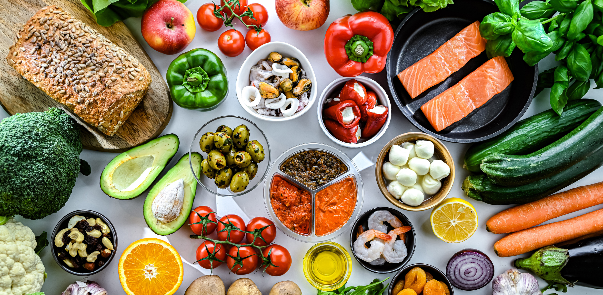 Close up table of various bright colored fruits and vegetables