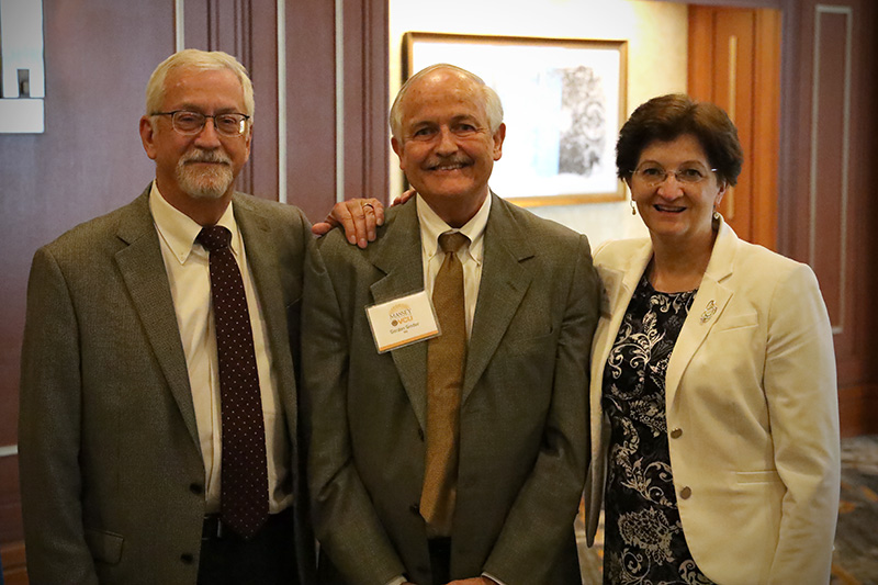 Dr. Ginder standing with Dr. Ley and Dr. Burns