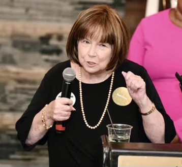 Sue Marshall speaking on stage