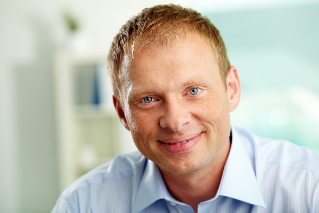 blonde man with blue eyes in shirt