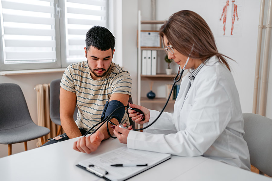 image_of_doctor_taking_blood_pressure