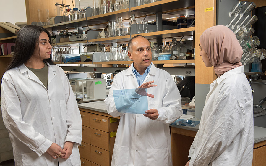 Devanand Sarkar, M.B.B.S., Ph.D. with a research team